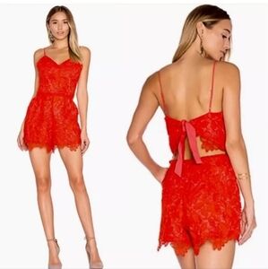Lovers + Friends Songbird Lace Romper in Coral Reef Red Medium
